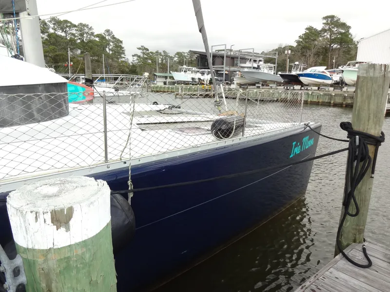 Slide: The Image of 2003 Lagoon 410 catamaran docked at marina. - 4