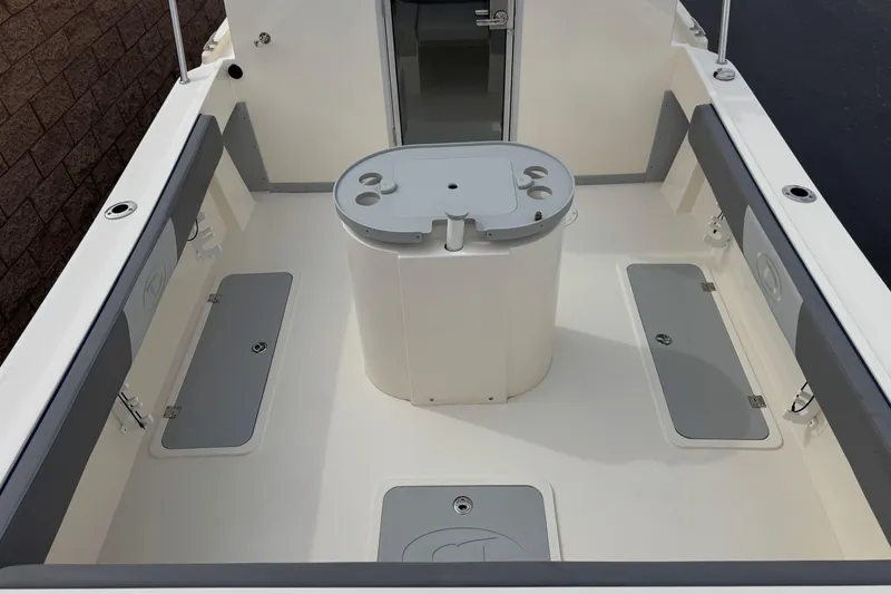 Slide: The Image of 2023 Defiance 220 Admiral EX boat interior with storage compartments and seating. - 11