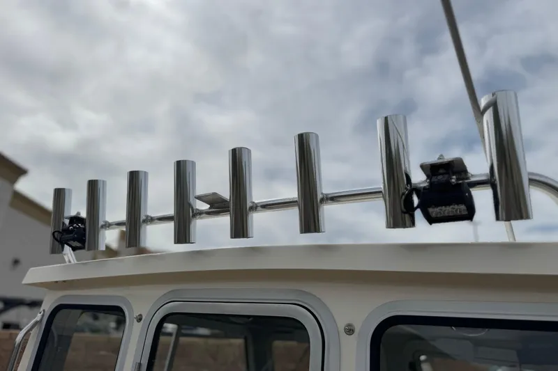 Slide: The Image of Stainless steel rod holders on 2023 Defiance 220 Admiral EX boat roof. - 18