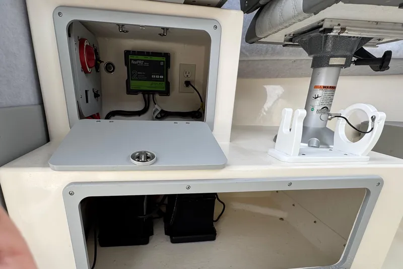 Slide: The Image of 2023 Defiance 220 Admiral EX boat interior with electrical panel and storage compartments. - 21