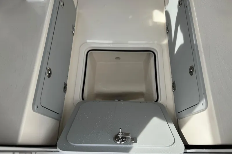 Slide: The Image of 2023 Defiance 220 Admiral EX boat storage compartment with open hatches. - 22