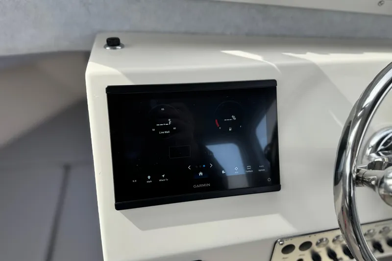 Slide: The Image of Garmin display on 2023 Defiance 220 Admiral EX boat dashboard with steering wheel. - 29