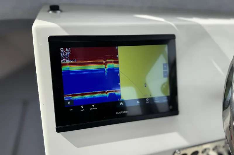 Slide: The Image of Garmin display on 2023 Defiance 220 Admiral EX boat dashboard, showing sonar and navigation data. - 31