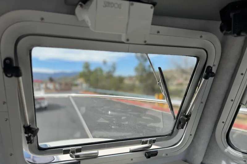 Slide: The Image of Interior view through window of 2023 Defiance 220 Admiral EX boat. - 32