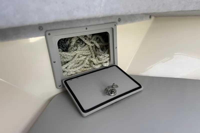 Slide: The Image of Storage compartment with ropes in 2023 Defiance 220 Admiral EX boat. - 35