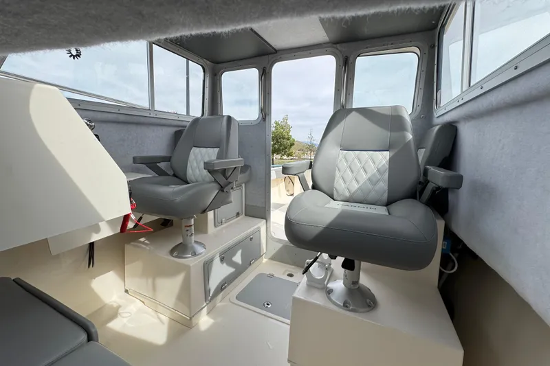Slide: The Image of Interior of 2023 Defiance 220 Admiral EX boat with modern seating and controls. - 36