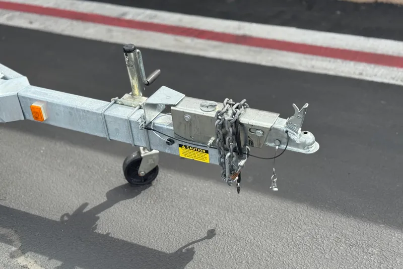 Slide: The Image of Trailer hitch of 2023 Defiance 220 Admiral EX on asphalt road. - 38