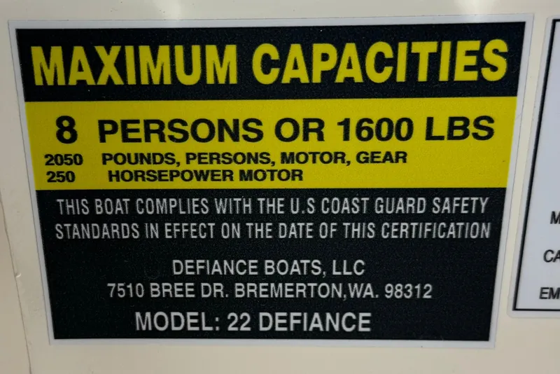 Slide: The Image of Defiance 220 Admiral EX 2023 boat capacity label: 8 persons or 1600 lbs, 250 HP motor. - 39