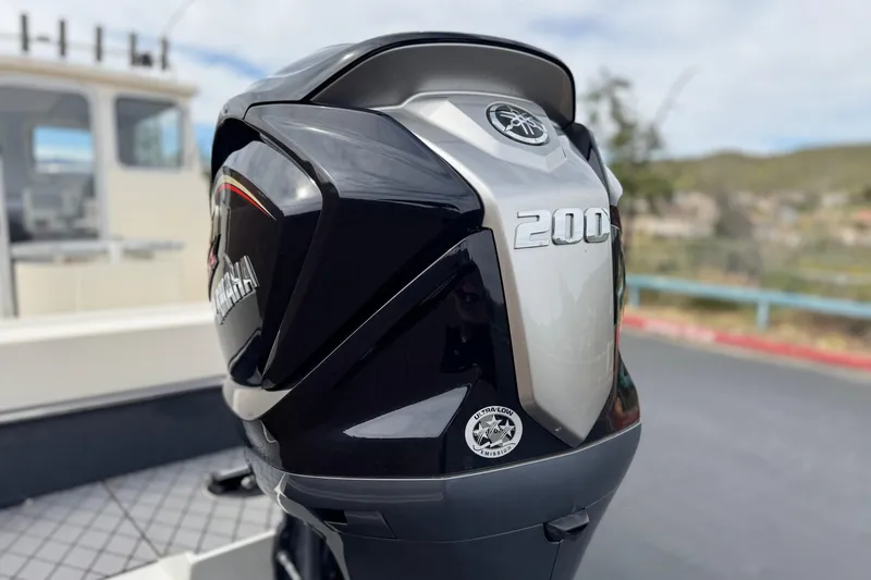 Slide: The Image of 2023 Defiance 220 Admiral EX boat with Yamaha 200 outboard motor. - 9