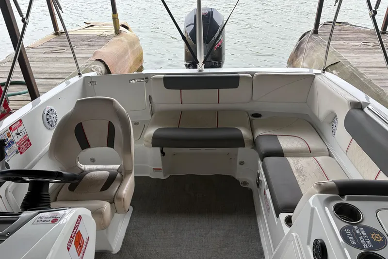 Slide: The Image of Interior of a 2021 Tahoe 1950 boat with seating and steering wheel. - 5