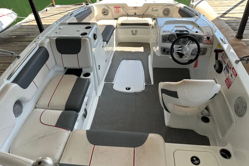 Slide: The Image of Interior of a 2021 Tahoe 1950 boat with seating and steering wheel. - 6