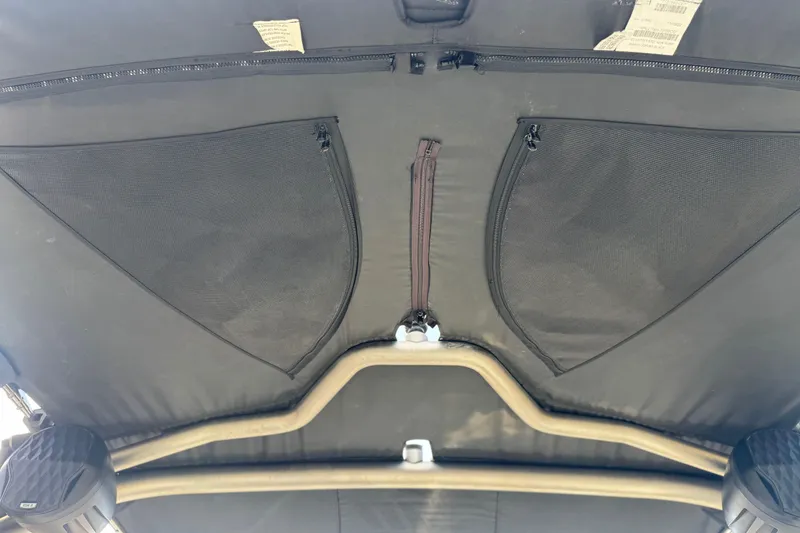 Slide: The Image of 2023 Malibu Wakesetter 21 LX interior roof with storage pockets and speakers. - 17