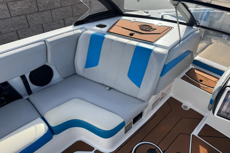 Slide: The Image of 2023 Malibu Wakesetter 21 LX interior with blue and white seating. - 24