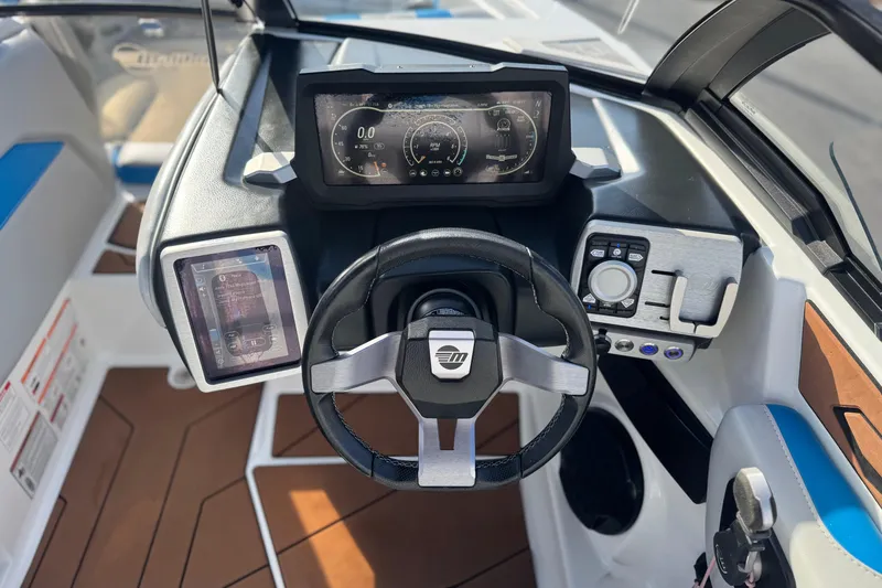 Slide: The Image of 2023 Malibu Wakesetter 21 LX dashboard with modern controls and digital displays. - 29