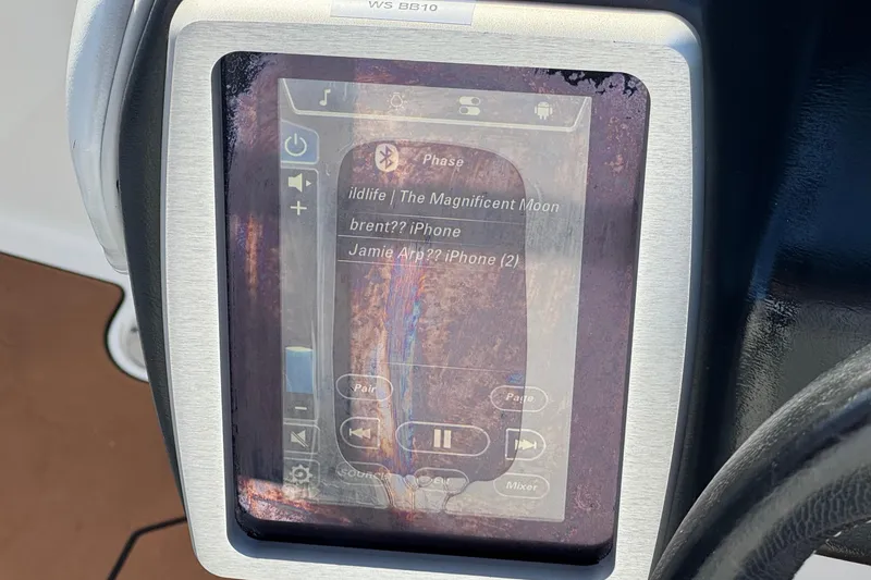 Slide: The Image of Touchscreen display in 2023 Malibu Wakesetter 21 LX boat showing music controls. - 30