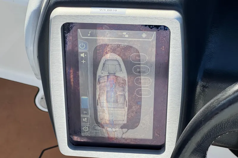 Slide: The Image of 2023 Malibu Wakesetter 21 LX touchscreen display showing boat controls and navigation. - 31