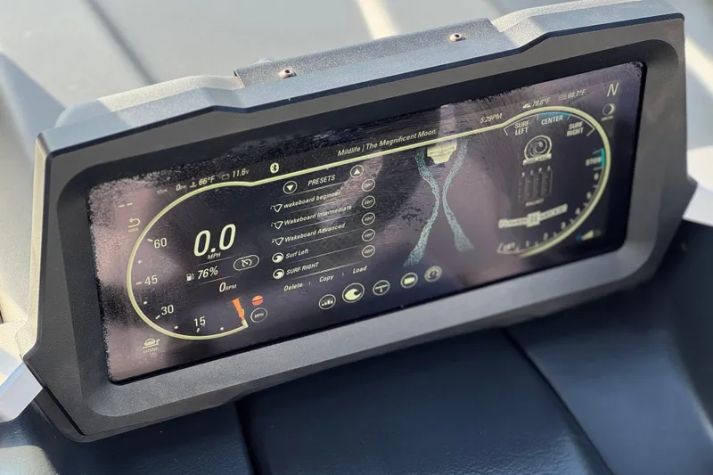 Slide: The Image of 2023 Malibu Wakesetter 21 LX dashboard display with speed and surf settings. - 34