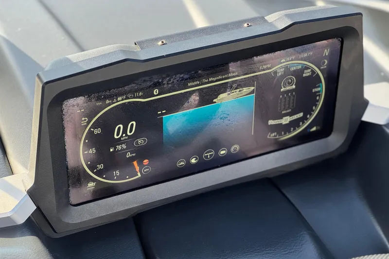 Slide: The Image of 2023 Malibu Wakesetter 21 LX dashboard display showing speed and navigation controls. - 35
