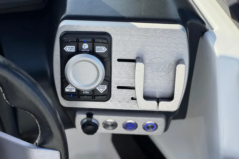 Slide: The Image of Control panel of 2023 Malibu Wakesetter 21 LX boat with surf and wedge adjustments. - 36