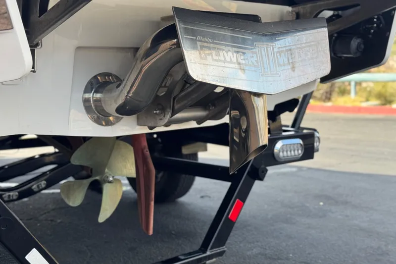 Slide: The Image of 2023 Malibu Wakesetter 21 LX boat stern with propeller and exhaust system. - 8