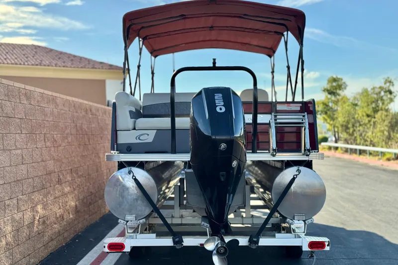 Slide: The Image of 2021 Crest Classic DLX 240 SLC pontoon boat with outboard motor and canopy. - 5