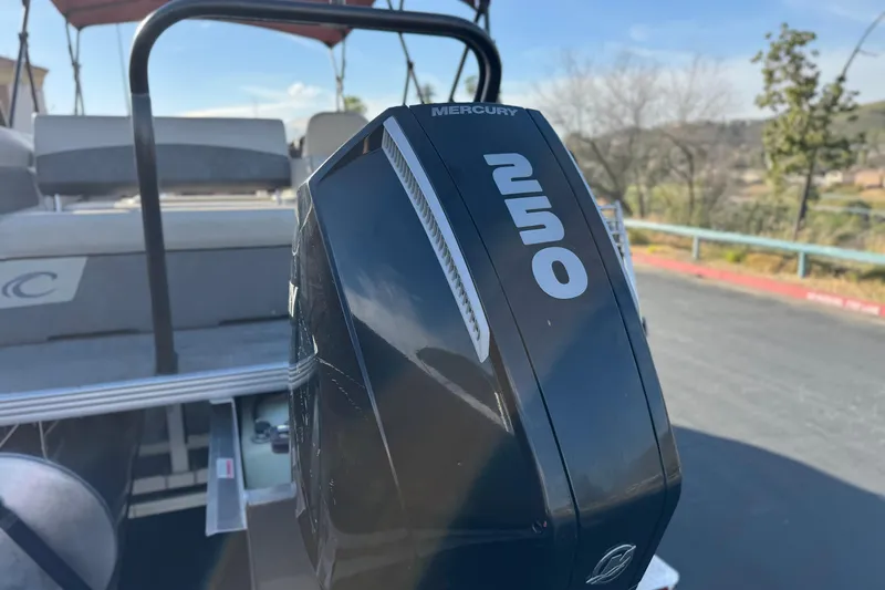 Slide: The Image of 2021 Crest Classic DLX 240 SLC with Mercury 250 outboard motor, parked outdoors. - 8