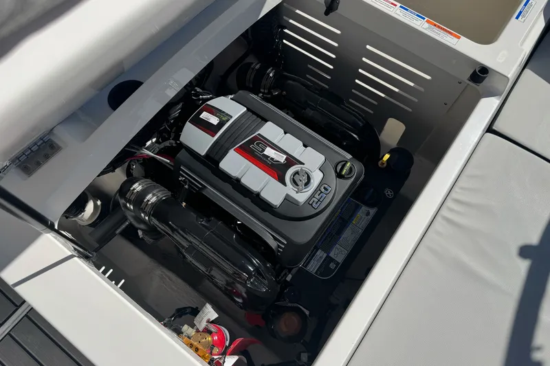 Slide: The Image of Engine compartment of 2026 Sea Ray SPX 210 boat, showcasing powerful motor design. - 27
