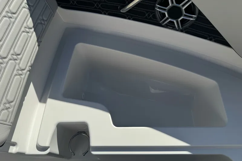 Slide: The Image of 2026 Sea Ray SPX 210 boat interior with speaker and seating detail. - 18