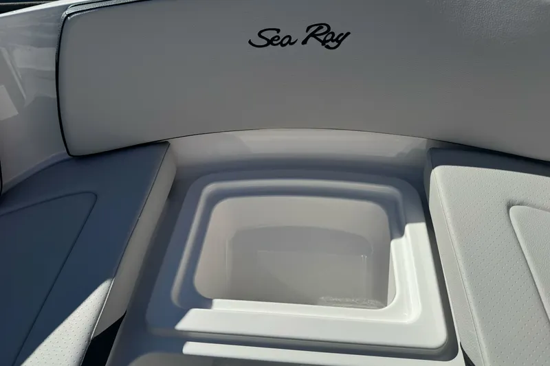 Slide: The Image of 2026 Sea Ray SPX 210 boat interior with storage compartment and seating. - 17