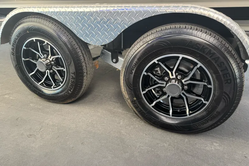 Slide: The Image of Trailer wheels with black alloy rims for 2026 Sea Ray SPX 210 boat. - 3