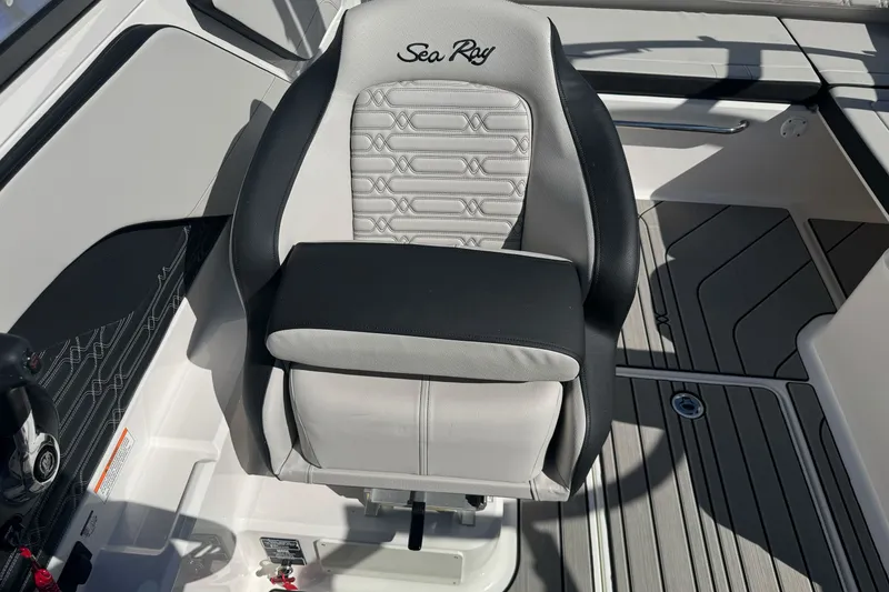 Slide: The Image of Captain's seat on 2026 Sea Ray SPX 210 boat, featuring sleek design and premium materials. - 24