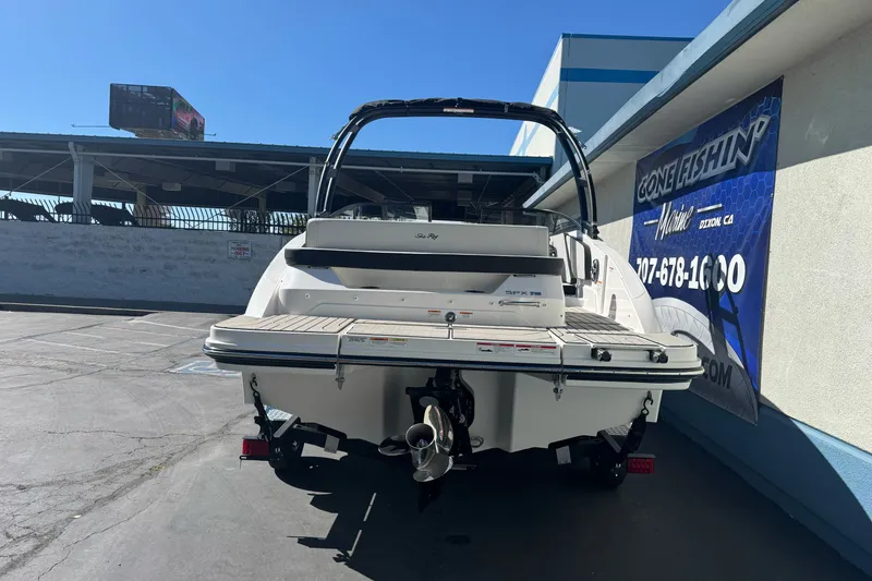 Slide: The Image of 2026 Sea Ray SPX 210 boat rear view at a marina. - 4