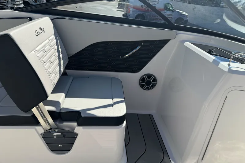 Slide: The Image of 2026 Sea Ray SPX 210 boat interior with sleek seating and modern design. - 14