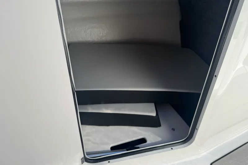 Slide: The Image of Interior storage compartment of 2026 Sea Ray SPX 210 boat. - 20