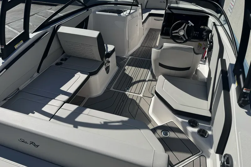 Slide: The Image of Interior view of 2026 Sea Ray SPX 210 boat, featuring sleek seating and modern design. - 8