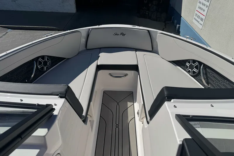 Slide: The Image of 2026 Sea Ray SPX 210 boat interior with sleek seating and modern design. - 15