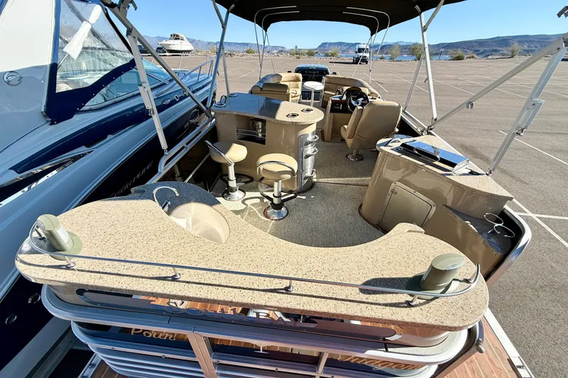 Slide: The Image of 2014 South Bay 724 E DLX TT pontoon boat with spacious seating and modern amenities. - 6