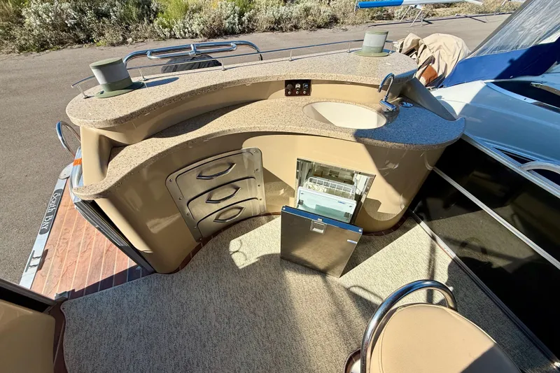 Slide: The Image of 2014 South Bay 724 E DLX TT boat interior with kitchenette and storage drawers. - 9