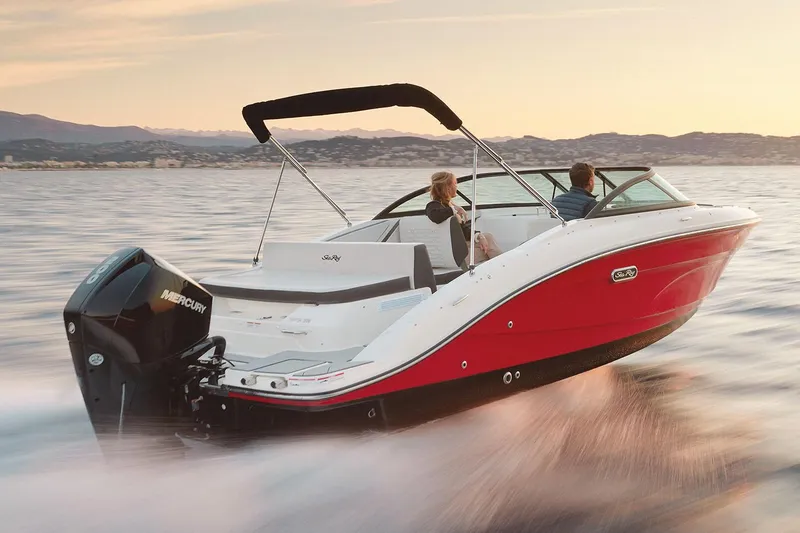 Slide: The Image of Manufacturer Provided Image: 2025 Sea Ray SPX 210 OB boat cruising on open water at sunset. - 20