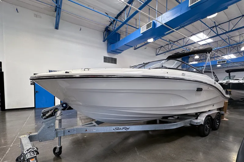 Slide: The Image of 2026 Sea Ray SPX 210 Outboard boat on trailer in showroom. - 3