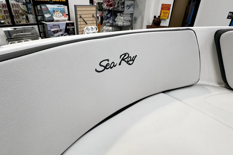 Slide: The Image of 2026 Sea Ray SPX 210 Outboard boat interior with logo on white upholstery. - 10