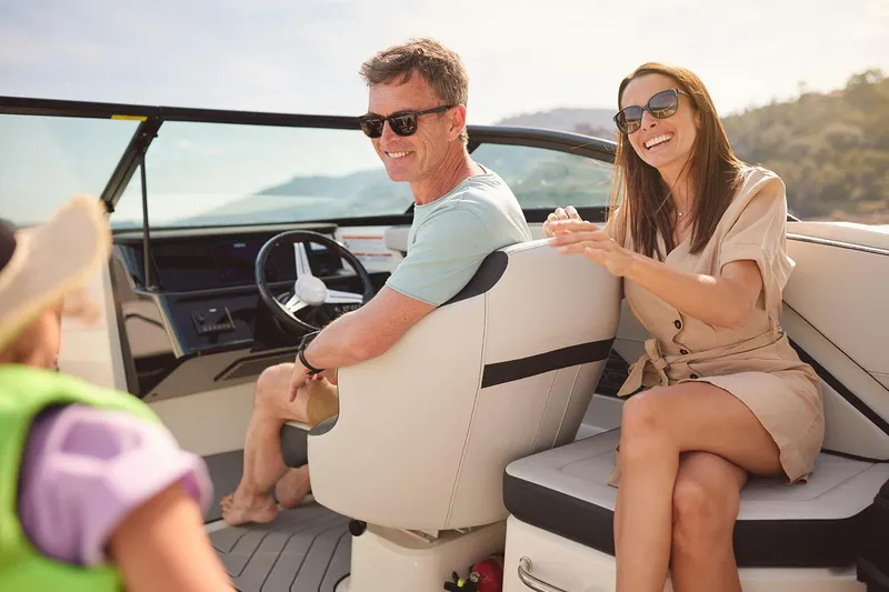 Slide: The Image of Manufacturer Provided Image: Couple enjoying a ride on a 2025 Sea Ray SPX 210 OB boat. - 24