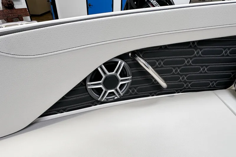 Slide: The Image of 2026 Sea Ray SPX 210 Outboard interior with speaker and stylish upholstery. - 11