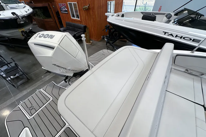 Slide: The Image of 2026 Sea Ray SPX 210 Outboard boat with Mercury engine in showroom. - 17