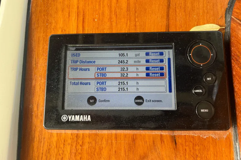 Slide: The Image of Yamaha display on 2016 Chris-Craft Calypso 26 showing trip data and engine hours. - 25