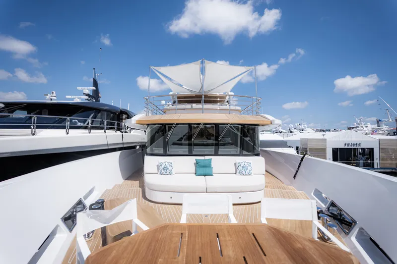 Slide: The Image of Luxurious 2020 Alpha Alfresco 125 yacht with elegant deck and seating under blue sky. - 10