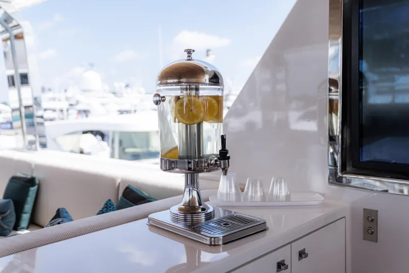 Slide: The Image of Lemon water dispenser on Alpha Alfresco 125 yacht, 2020 model, with marina view. - 12