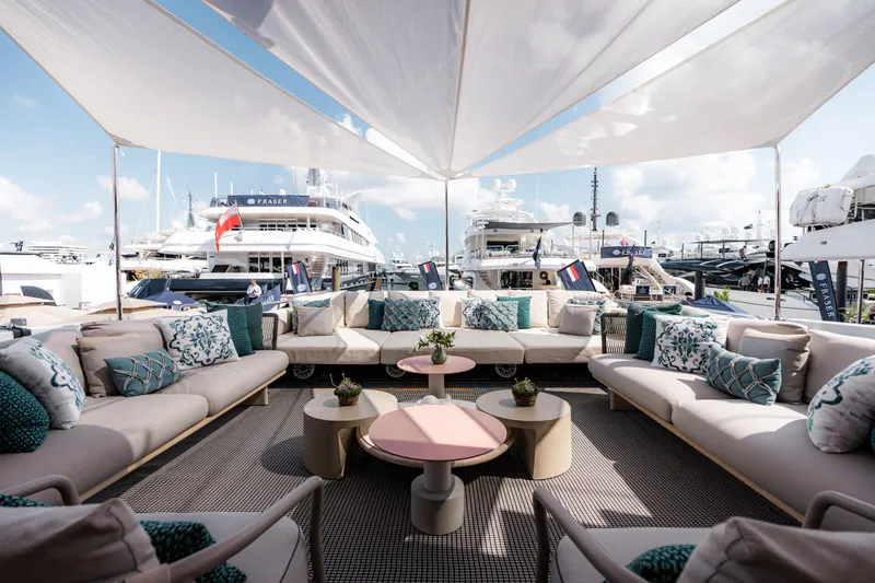 Slide: The Image of Luxurious yacht deck with elegant seating, shaded canopy, and marina view, featuring Alpha Alfresco 125, 2020. - 14