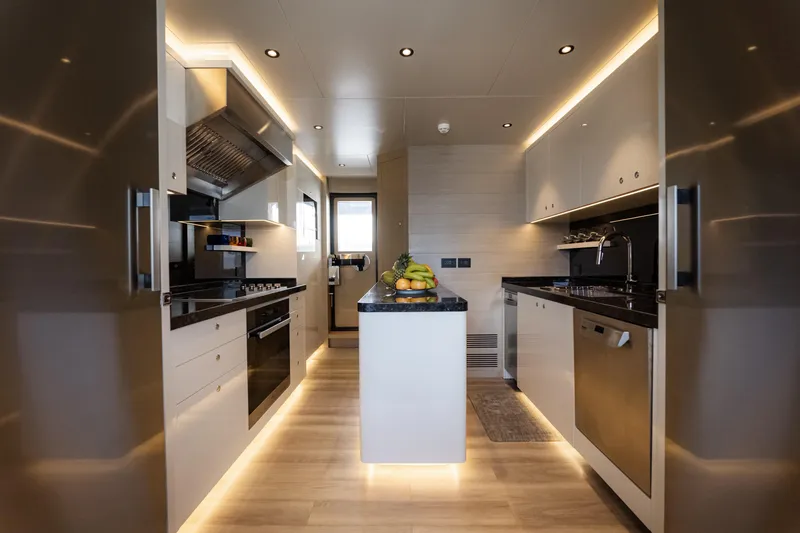 Slide: The Image of Modern kitchen interior on Alpha Alfresco 125 yacht, 2020 model, featuring sleek design and ambient lighting. - 18