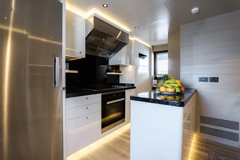 Slide: The Image of Modern kitchen interior on Alpha Alfresco 125 yacht, featuring sleek design and stainless steel appliances. - 19